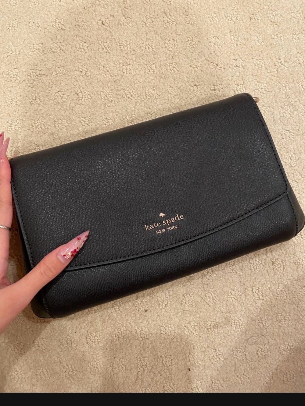 kate spade black leather clutch with gold logo